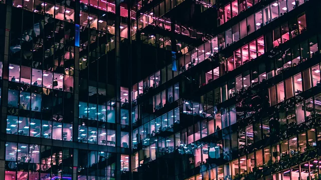 Illuminated office windows, illustrative photo for a company-office hotel stay