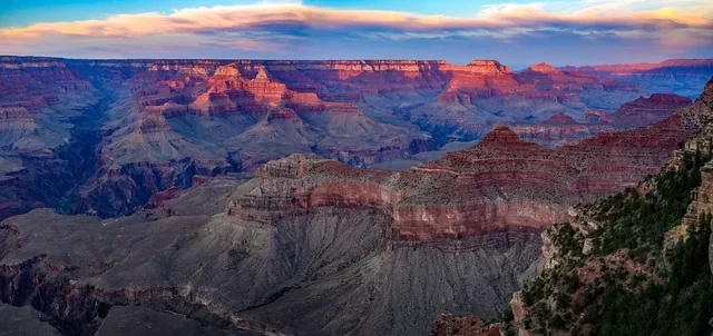 Sunset over the layered cliffs and valleys of the Grand Canyon