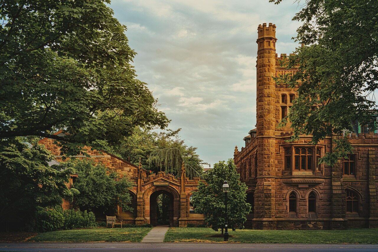 Murray-Dodge Hall and a tree-lined archway at Princeton University